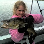 Girl holding fish caught signature fishing rods