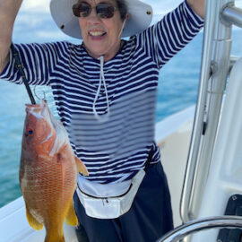 Joann is happy to catch Red Snappers