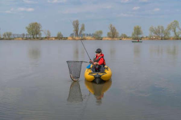 A person fishes from a kayak